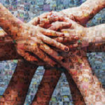Stack of hands showing unity