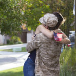 Military Man Returns From War WS
