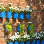 4-blue-painted-tin-can-wall-container-garden