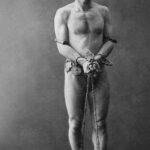 Harry Houdini in chains