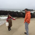 Monmouth student & Prof Adolf sampling ocean in Long Branch